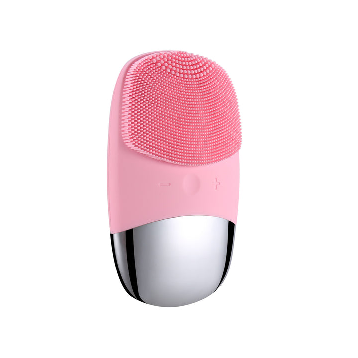 Pink and silver facial cleansing brush on a white background