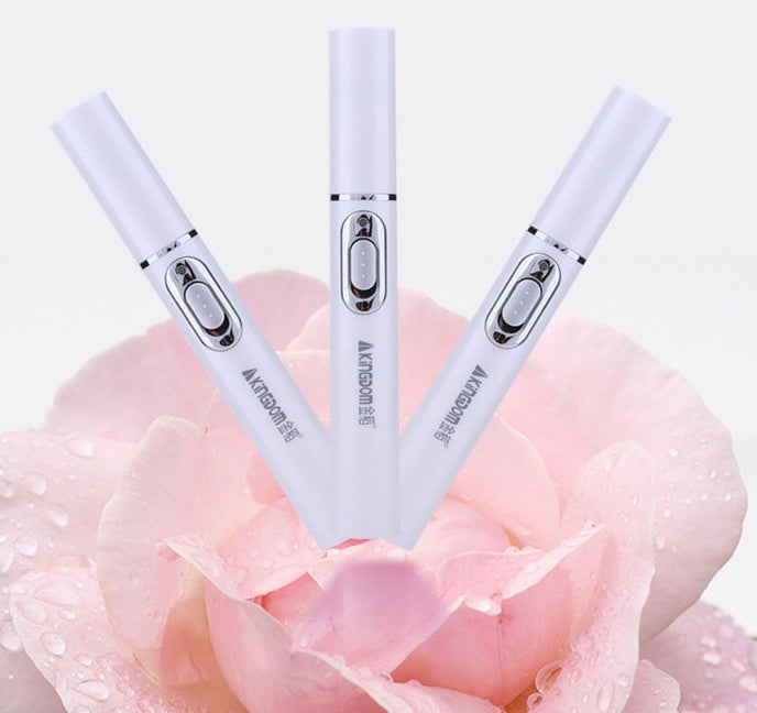 Three white electronic devices with silver accents on a pink floral background