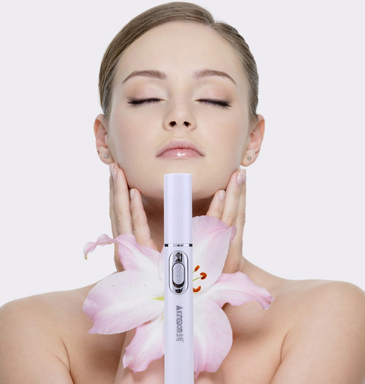 Woman holding a white electronic device with pink flowers against a light background