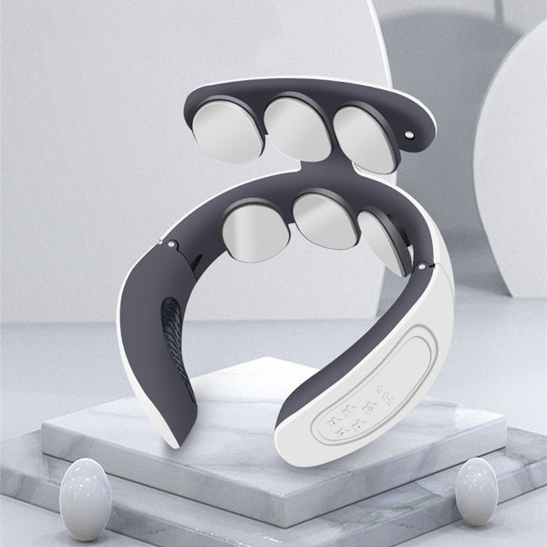 Neck and shoulder massager on a marble surface with a light gray background