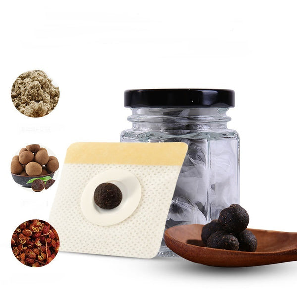 Glass jar with black lid, beige square container, and wooden plate with dark brown spherical objects on a white background.