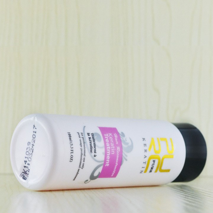 Serelivia Professional Brazilian Keratin Hair Treatment bottle on wooden background for deep hair repair.