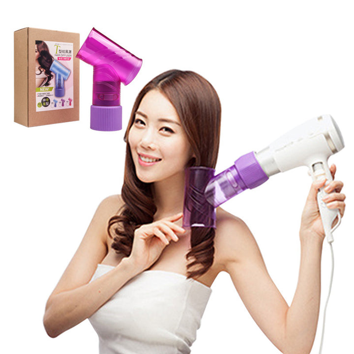 Woman using a purple handheld hair dryer with a white blow dryer, box in the background