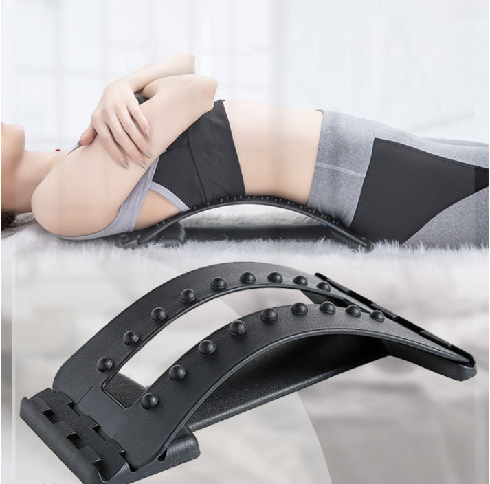 Person using a black massage device on their leg with a white background
