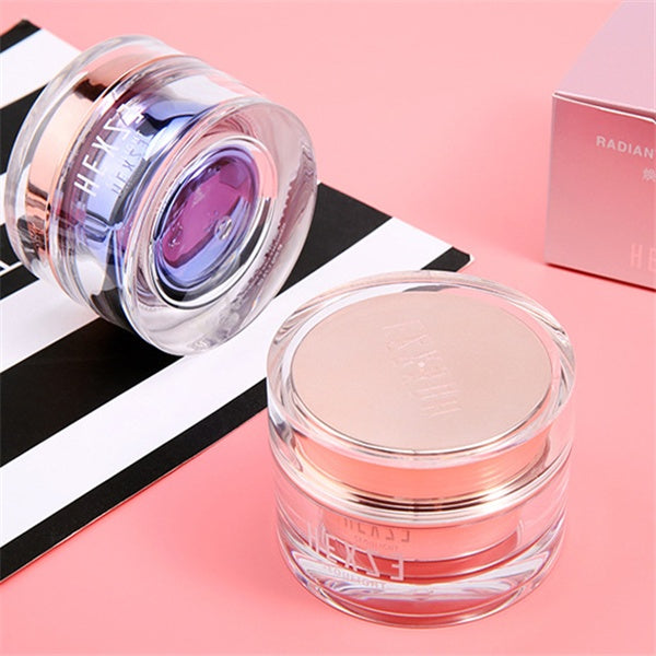 Cosmetic jar with pink lid on a pink background