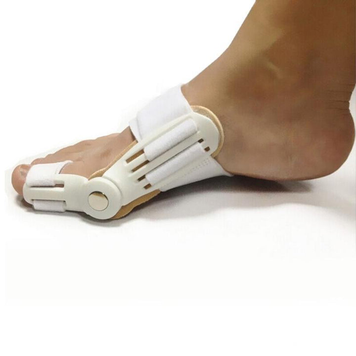 Foot with a white orthotic device on a white background