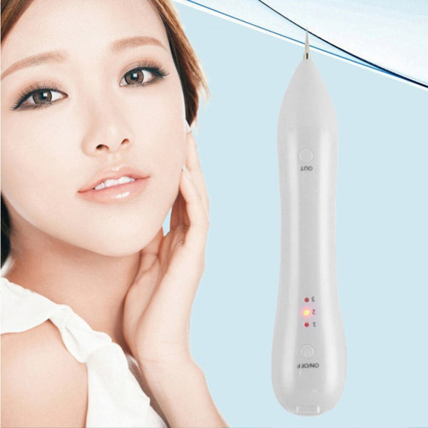 Woman touching her face with a skincare device on a light blue background