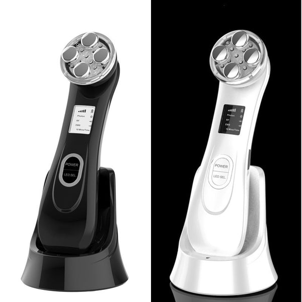 Black and white handheld electronic devices on stands with digital displays.