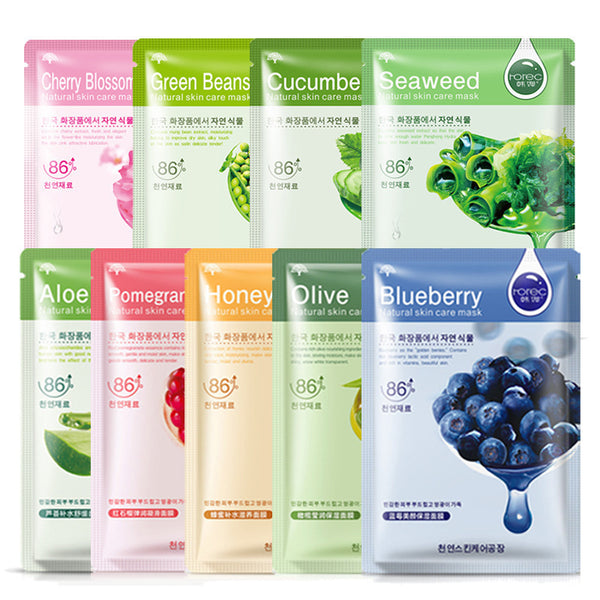Set of facial mask packages with various ingredients on a white background