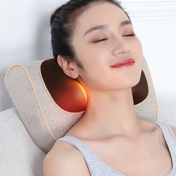 Woman using a neck and shoulder massager with glowing red light